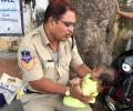 Telangana cop wins hearts as he babysits child while mother writes exam