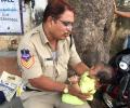 Telangana cop wins hearts as he babysits child while mother writes exam