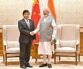 What was Xi Jinping's confidant doing in India?