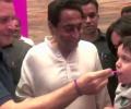 WATCH: Rahul's sweet moment as he feeds ice-cream to a child