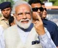 PM Modi votes, says 'voter ID' more powerful than IED