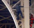 Eiffel Tower evacuated as man tries to scale it