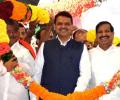 Exodus from NCP continues; Naik, son, 50 corporators join BJP