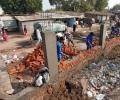 Ahmedabad builds Trump wall to keep slums out of sight