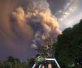 Couple get married as volcano erupts behind them