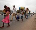 No option left, migrant labourers walk for days to reach home