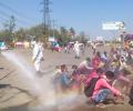 Workers hosed down with chlorine, opposition outraged