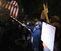 As US counts votes, protesters take to the streets