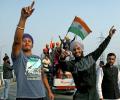 Farmers receive rousing welcome on their way back home