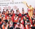 Modi showers floral petals on Kashi corridor workers