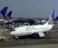 Passenger opens plane emergency exit, walks on wing in US