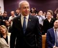 Defiant Netanyahu takes stand in landmark graft trial