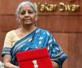 Tablet in a red pouch, FM presents 3rd paperless Budget