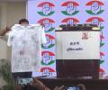 Displaying washing machine, Cong taunts BJP over clean chit to Praful Patel