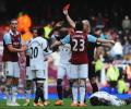 Carroll controversially sent off as West Ham thump Swansea