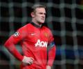 England's Rooney signs new long-term United deal