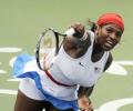 Williams sisters power on in Beijing