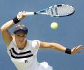 Clijsters marches on, Williams sisters ousted