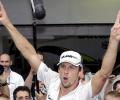 Button spends sleepless night as F1 champion