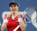 Comeback mum Clijsters stuns Venus