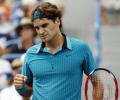 Federer shakes off rust to advance in Toronto