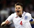 Gerrard rescues England to ease World Cup gloom