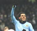 Tevez hat-trick fires City into the top four 