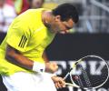 Tsonga wins five set thriller to enter quarters