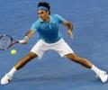 Federer awakes from slumber to beat Davydenko