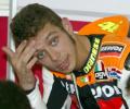 Rossi rides again, hopes for early return