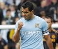 Man City halt Chelsea charge with Tevez winner