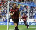 Silva service lifts City top with win at Bolton