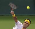 Federer produces trademark 'tweener' in Doha win