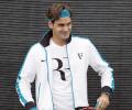 Federer overcomes feisty Portuguese