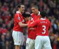 United beat Arsenal to keep treble dreams alive