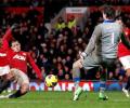 Man United win seven-goal thriller while City lose