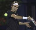 Federer cruises in Dubai as Murray labours