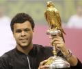 Tsonga beats Monfils to win misty Qatar Open