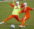 Football body approves goal-line technology, hijab