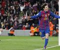 Record man Messi helps Barca close gap on Real