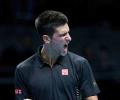 Djokovic fights back to beat Murray at Tour Finals