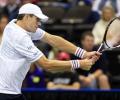 Isner survives opening Delray test, Nishikori quits