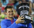 Tomic, Hewitt give locals hope; Ferrer equals record