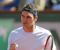 Federer fights back to clinch Halle title