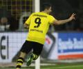 Lewandowski hat-trick helps Dortmund crush Stuttgart