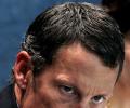 Armstrong settles $3 million lawsuit over bonuses