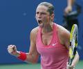 Vinci storms into US Open quarters before rain halts play