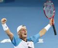 Hewitt grinds down Federer to clinch Brisbane title