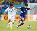 Ten-man Greece hold Japan goalless