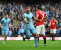 Ten-man United beaten in Van Gaal's first Manchester derby